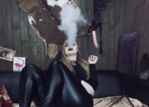 Domineering woman who smokes dressed in leather