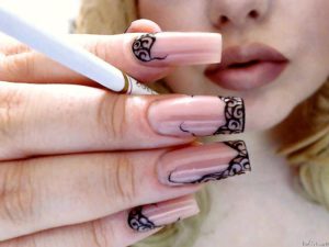 Mistress with beautiful nails and cigarette