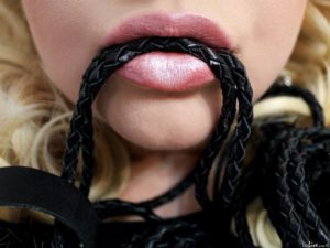 Mistress with beautiful lips are sensual, ready to act with a skin whip